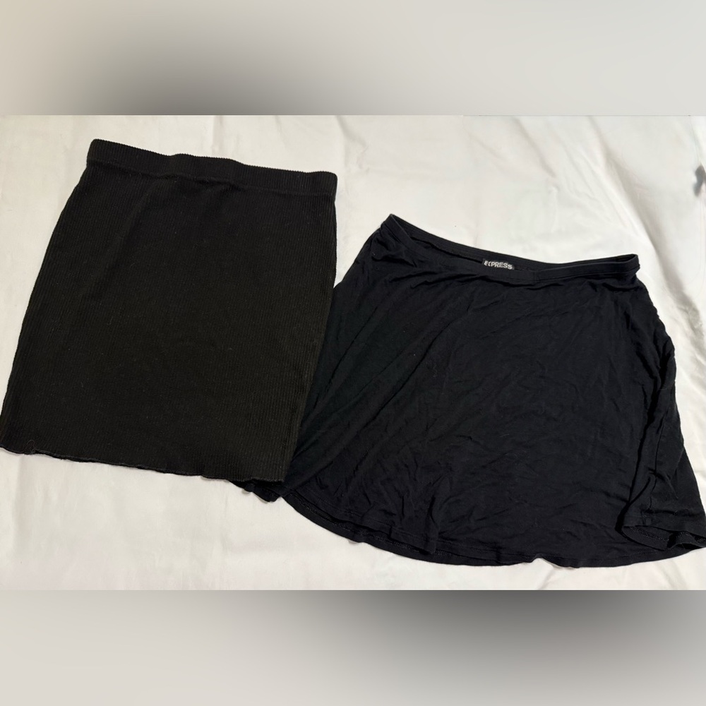 2 black mini skirts. Express. Sz M. 1 ribbed straight and 1 flowy skirt.